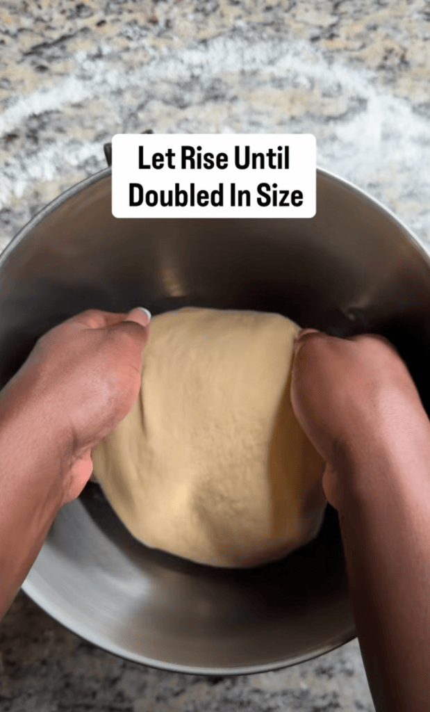 Hands kneading dough in a metal bowl, with a reminder to let it rise until doubled in size.